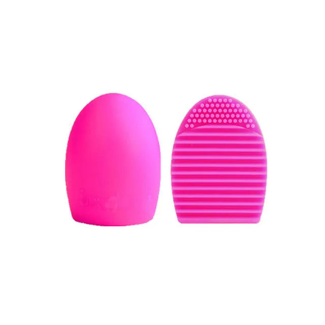 Silicone makeup brush wash egg in blue with top knobs and bottom grooves for cleaning bristles