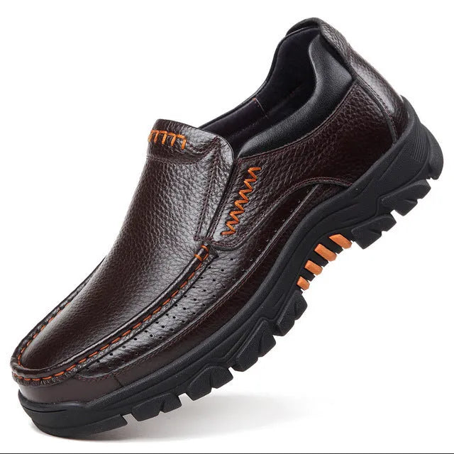 Men's black and brown cowhide leather business casual slip-on shoes with a rubber sole.