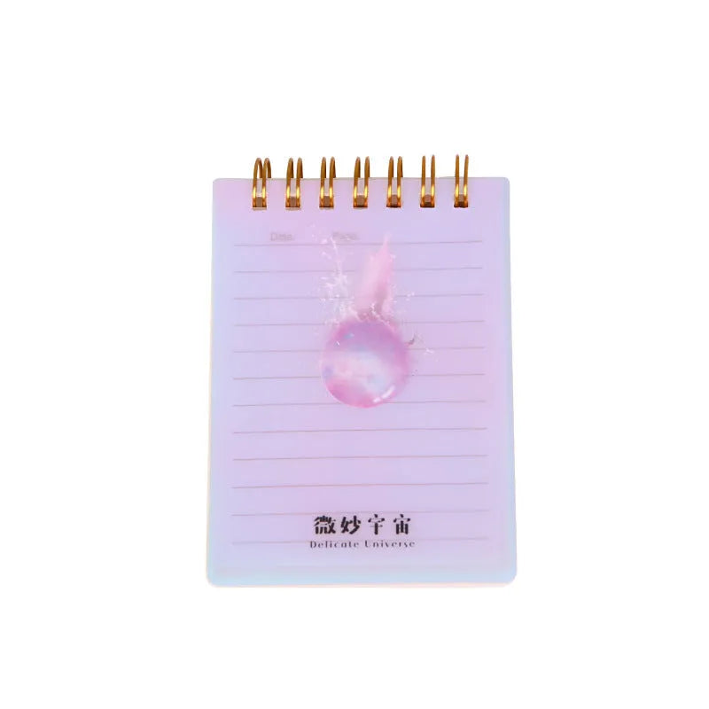 Set of four A7 spiral-bound pocket notebooks with different coloured PP covers showing Constellation, Sakura, Ocean, and Universe designs.