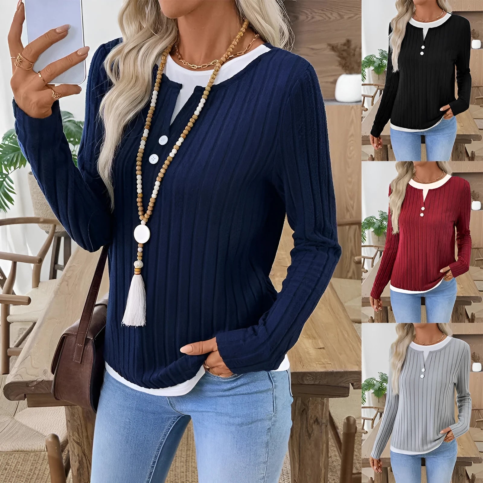 Women's black fake two-piece round neck pullover sweater with long sleeves.