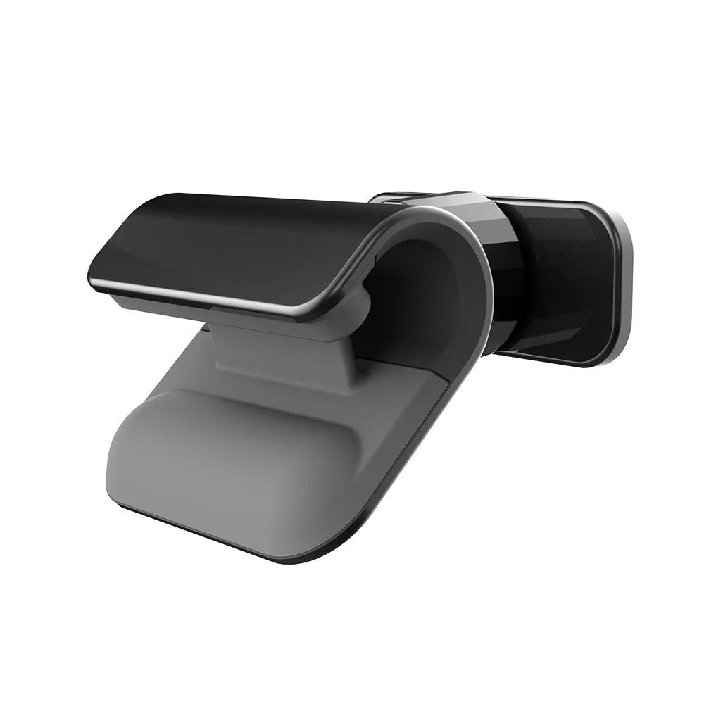 Black universal gravity car phone holder showing 360-degree rotation, mounted on a car air vent.