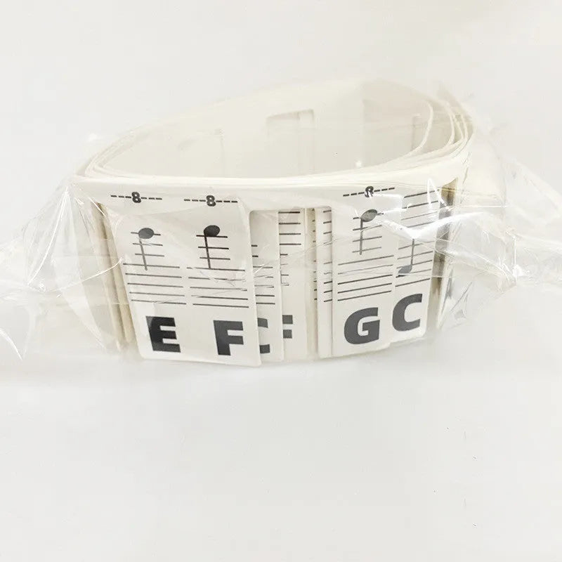 White cardboard piano keyboard stickers for 88-key staff notation learning with coloured note bars