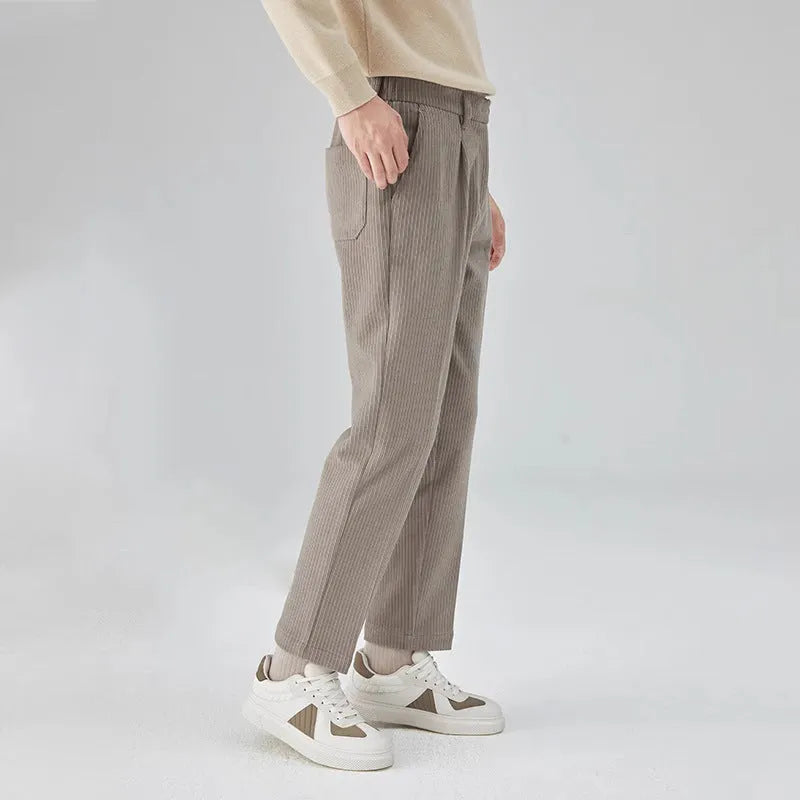 Men's straight-leg corduroy trousers in loose fit, shown in beige colour