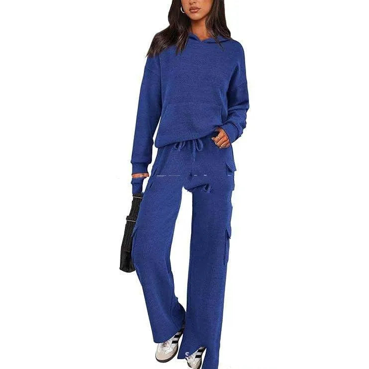 Women's long sleeve leisure sport suit top and trousers set in polyester fabric.