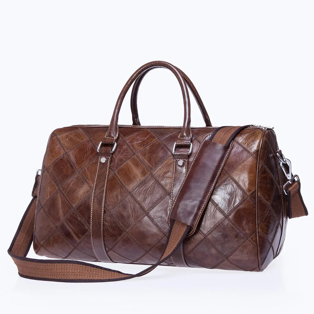 Vintage brown cowhide leather men's duffel bag with a single shoulder strap, shown open to reveal internal phone pocket and zippered compartment.