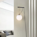 Modern Nordic glass wall lamp with three light colour options on a contemporary wall