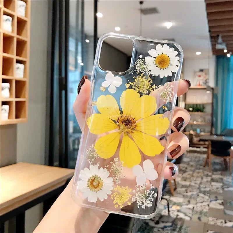 iPhone phone case with a large pink floral design on a flexible TPU back cover.