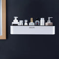 Plastic wall-mounted bathroom shelf with hole-free installation on a polished wall.