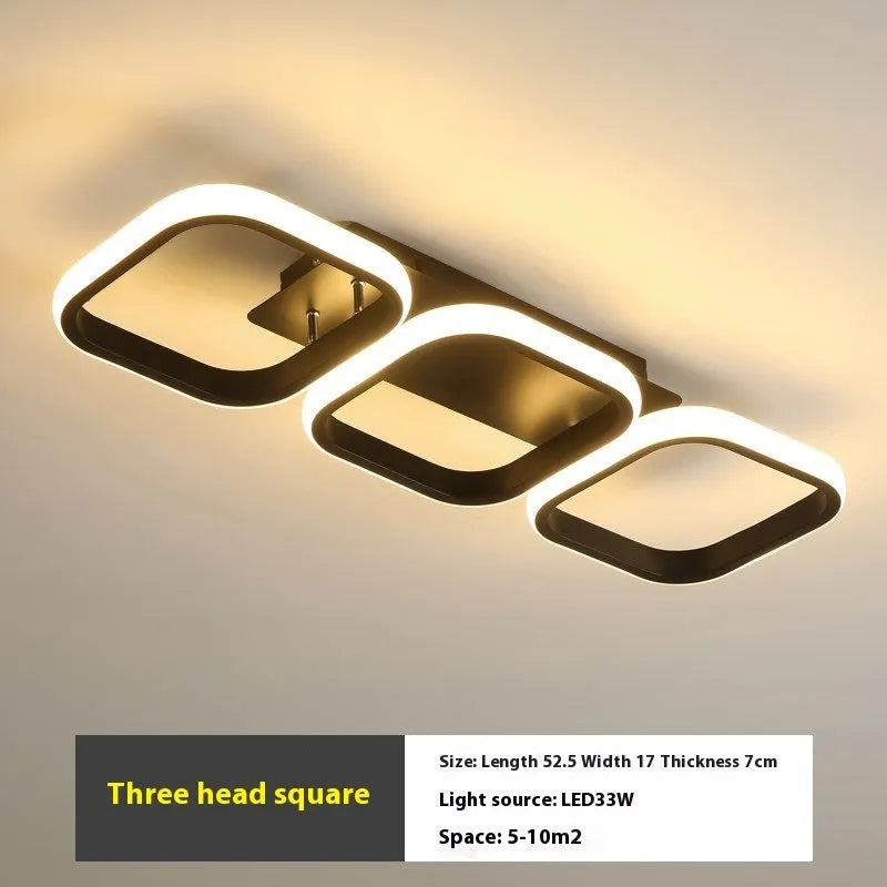 Modern simplicity hallway LED ceiling light in black with three round shapes over a corridor