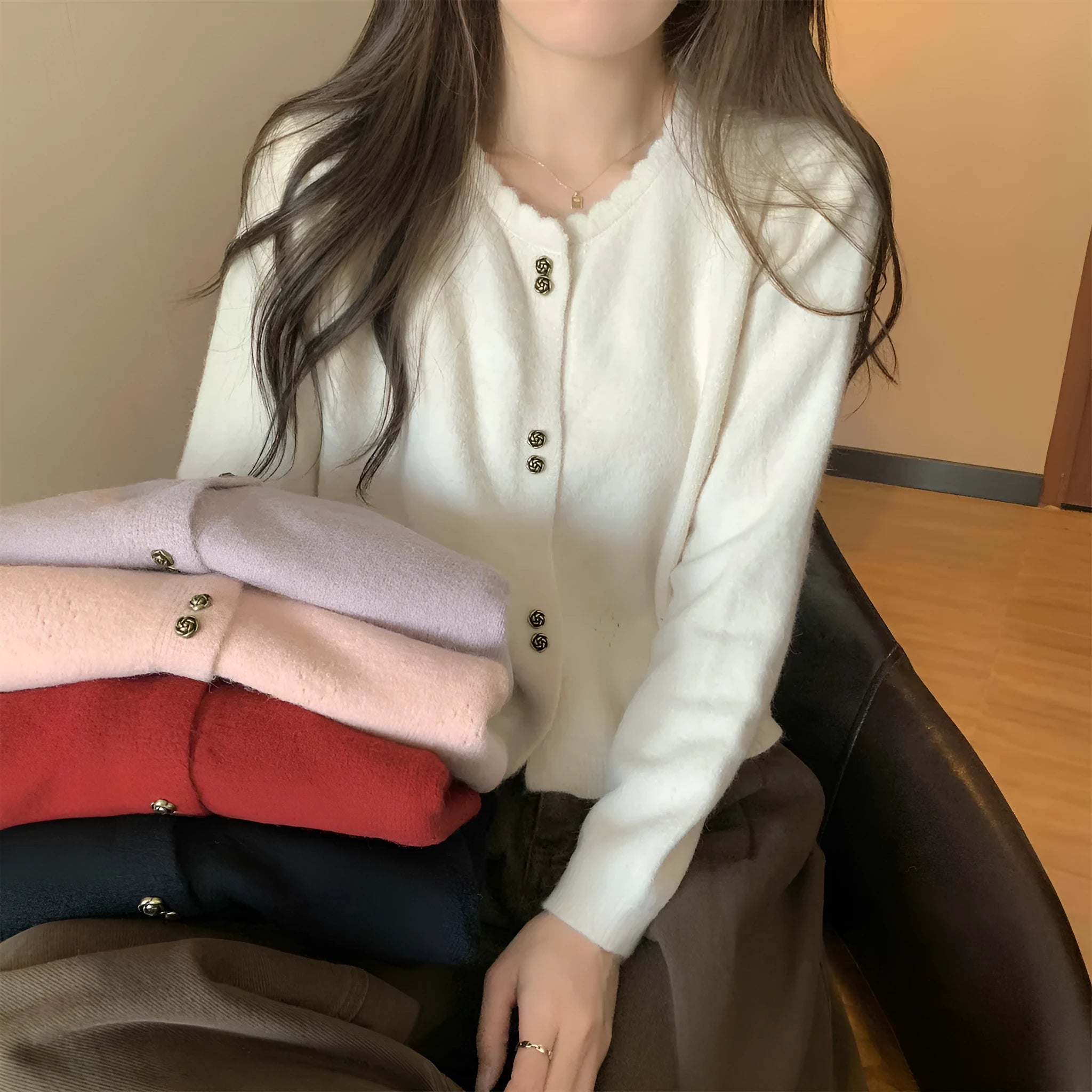 Women's milky white acrylic long-sleeve cardigan coat worn open, free size regular fit.