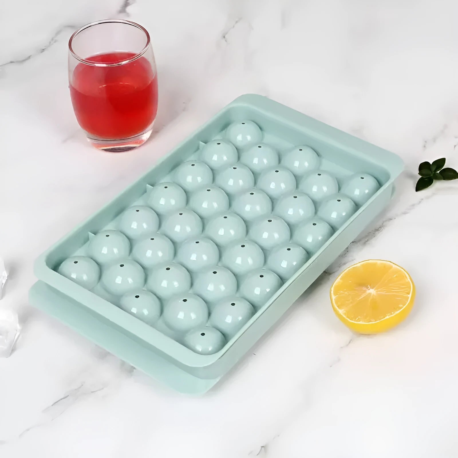 Large blue silicone ice cube tray with 33 round grids and a clear lid