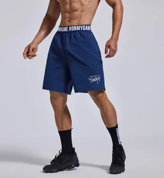 Men's loose-fit cropped sports shorts in black with elastic waist and letter details