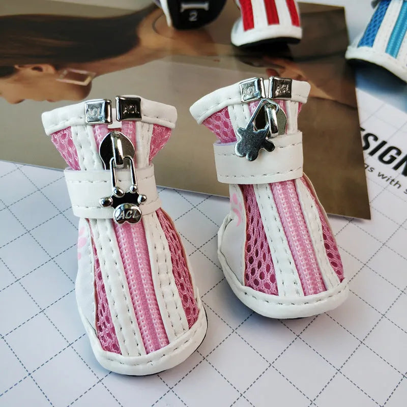 Blue zipper dog shoes with non-slip sole from a four-pair pet sneaker set.