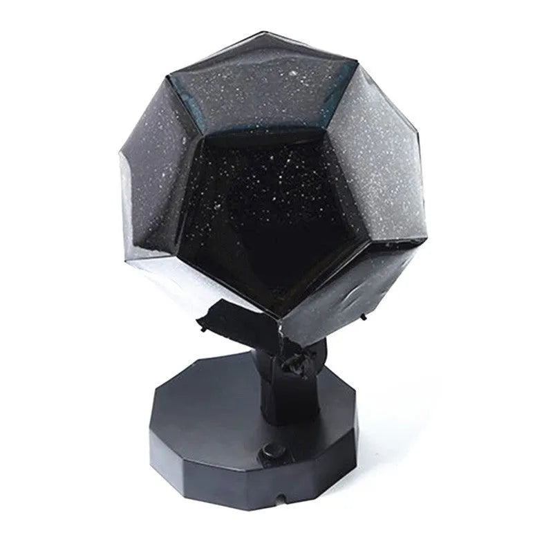 LED starry sky projector night light showing constellation projection on a bedroom ceiling.