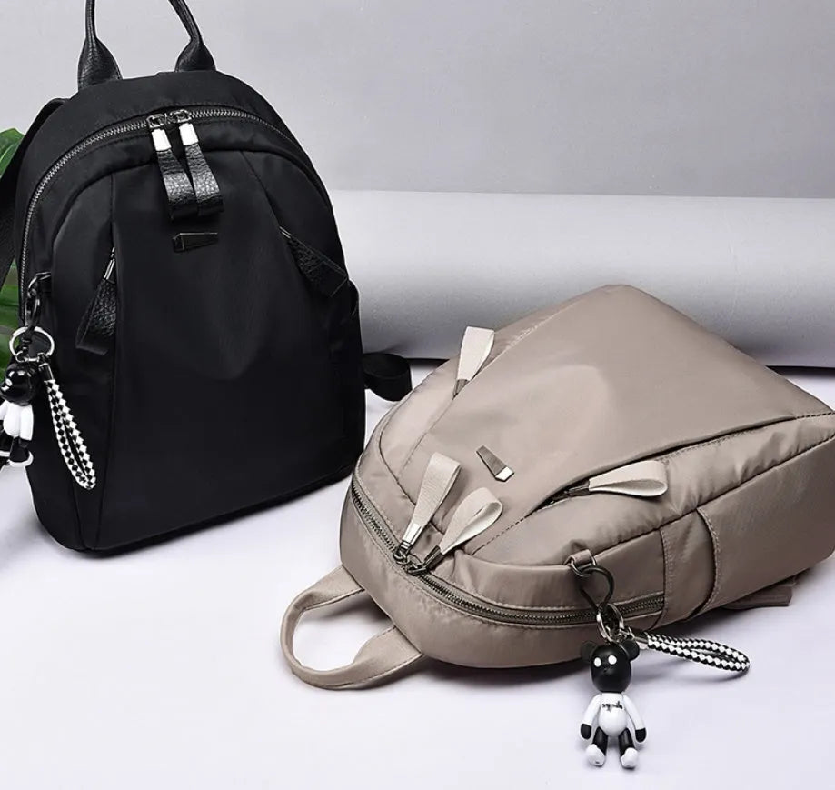 Medium Oxford cloth rucksack with internal phone and ID compartments in wine red colour