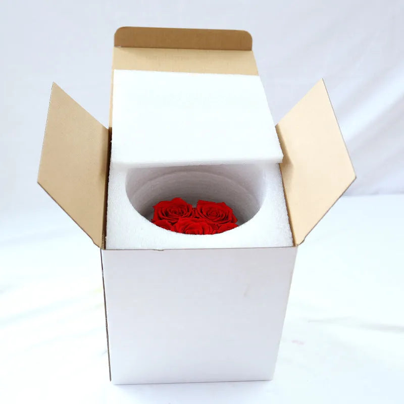 Handmade everlasting rose in hug bucket with preserved flower material, available in white red pink black blue colours