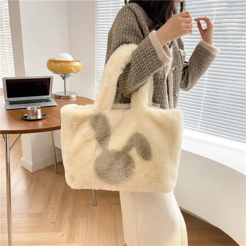 Plush shoulder bag with cartoon rabbit ears design in solid colour options