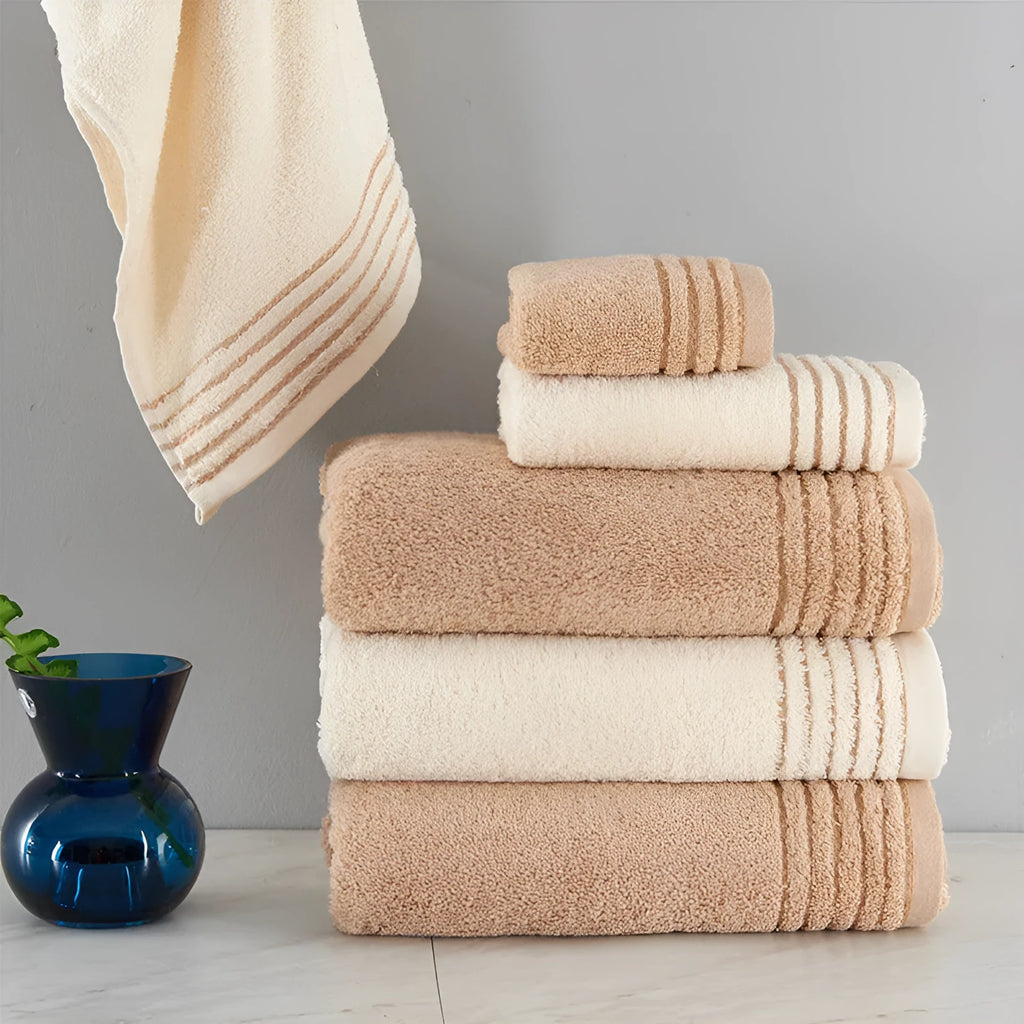 Cotton towel set in beige and brown with 395 GSM weight including bath towel, hand towel, and face cloth