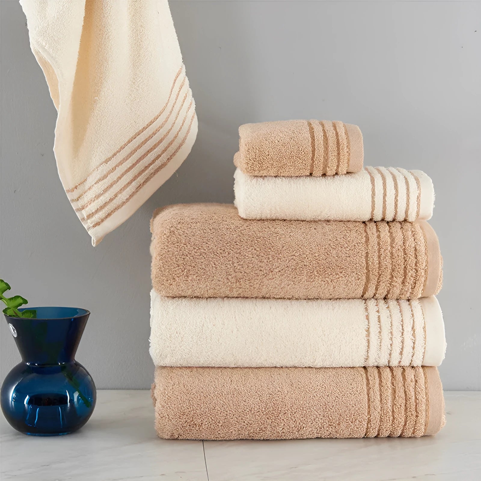 Cotton towel set in beige and brown with 395 GSM weight including bath towel, hand towel, and face cloth