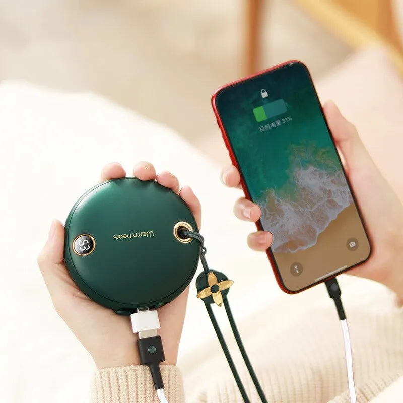 Green hand warmer power bank with digital display showing battery percentage and temperature setting