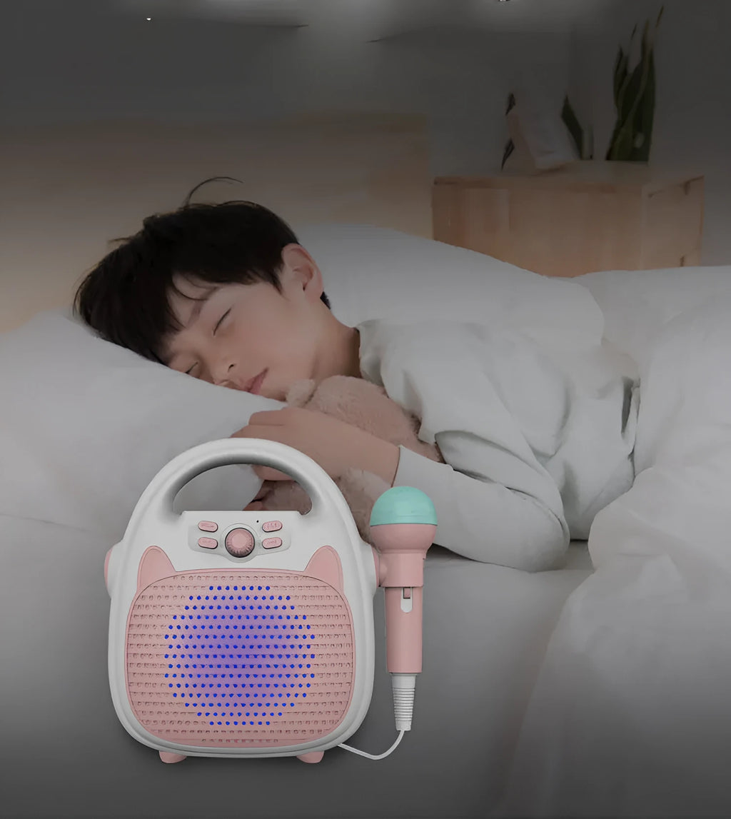 Blue kids karaoke machine with built-in microphone, disco lights, and phone holder on a table
