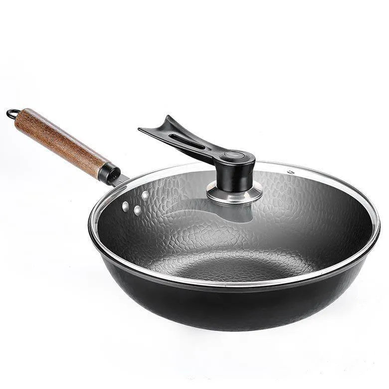 Traditional handmade iron wok pan with wooden handle and induction-compatible base