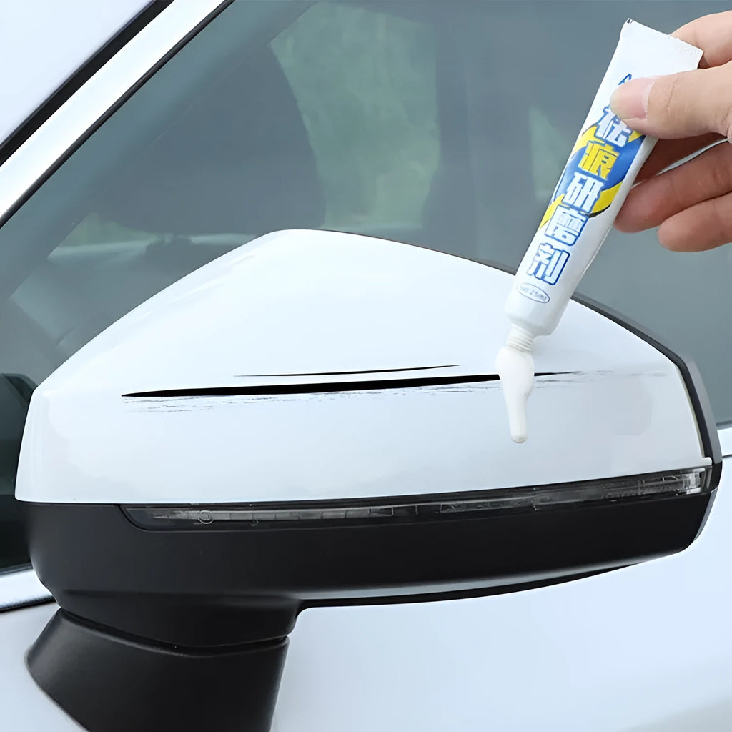 Automotive scratch repair kit with paint pen, wax, sponge, and sandpaper for car touch-ups