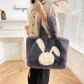 Plush shoulder bag with cartoon rabbit ears design in solid colour options