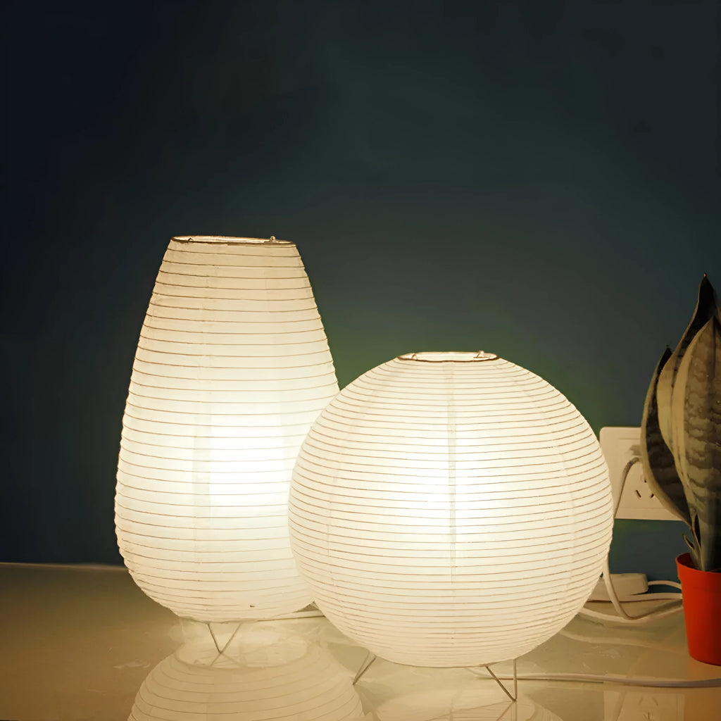 Small white table lamp with rice paper shade on bedside table, circular shape, traditional handwork