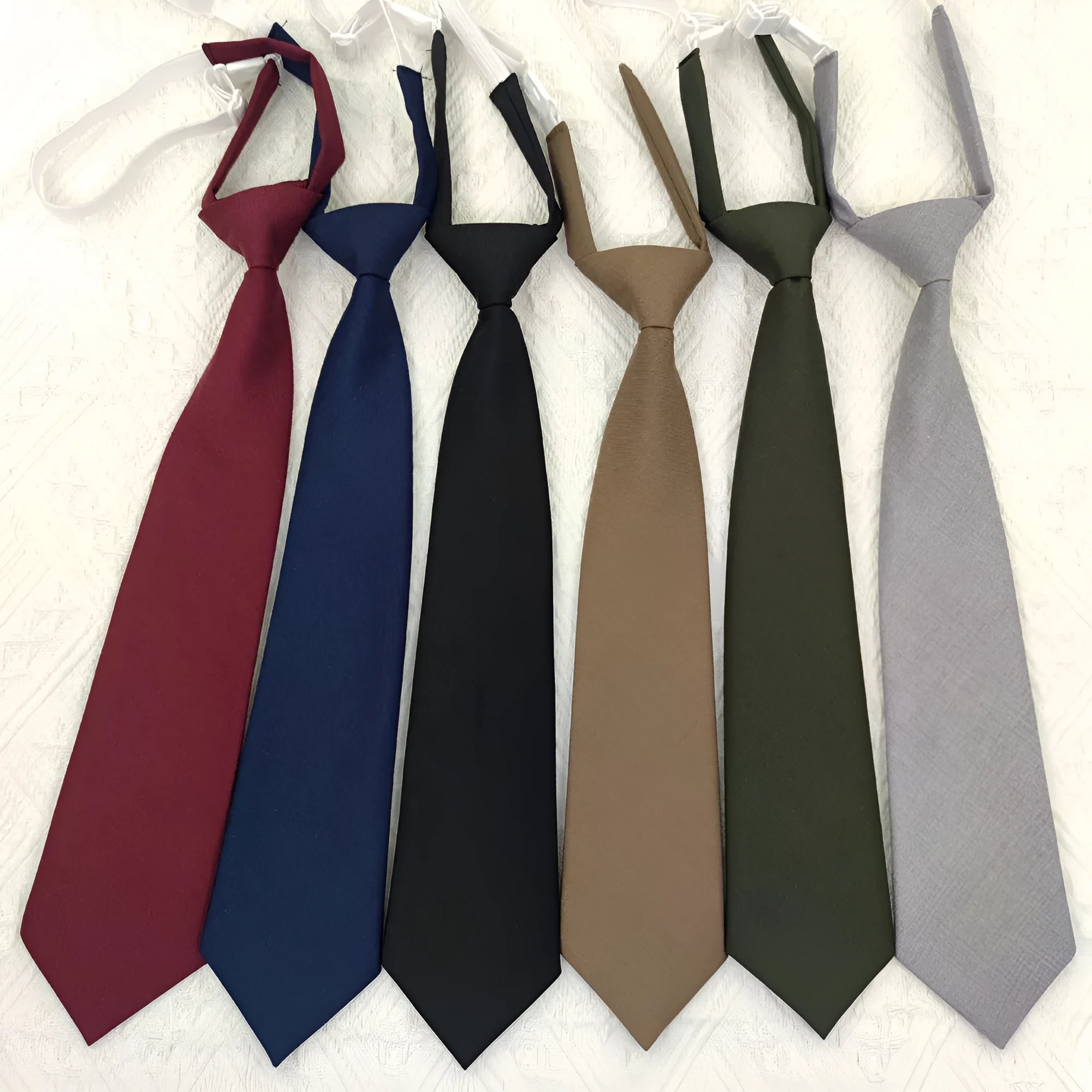 Men's navy blue cotton bow tie with arrow-type styling showing traditional bow tie shape and dimensions