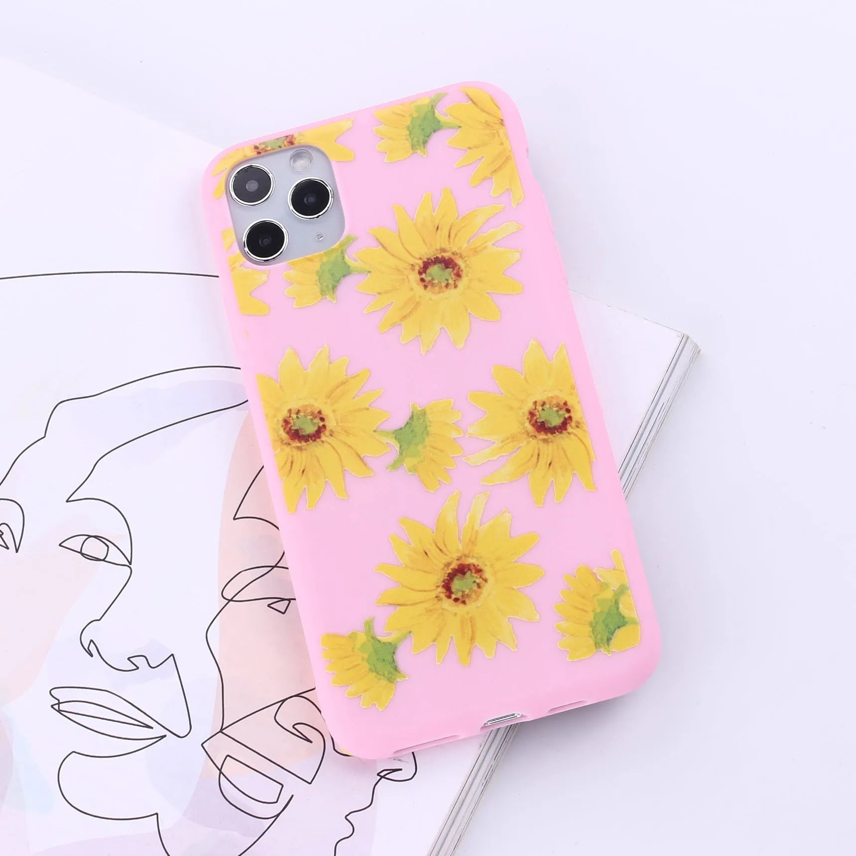 Slim TPU mobile phone case for iPhone on a table, showing one of 14 available colour options.