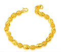 Gold-plated brass bracelet with thick vacuum gold coating on a white background