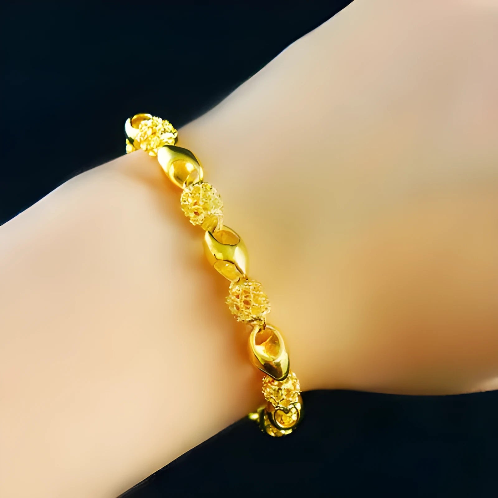Gold-plated brass bracelet with thick vacuum gold coating on a white background