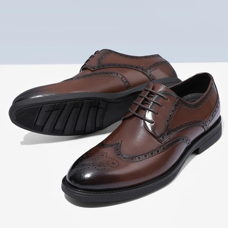 Men's black brogue leather shoes in a business style on a white background.