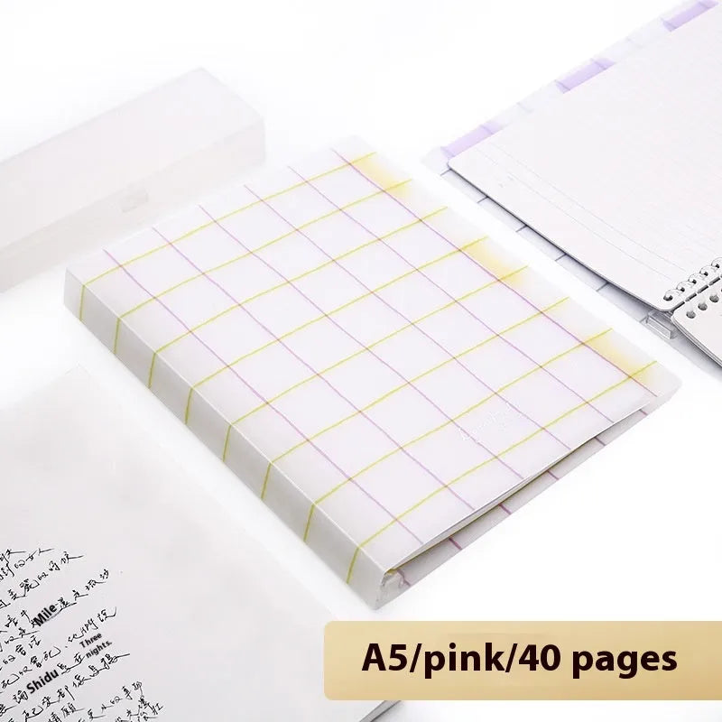 Loose-leaf spiral notebook with PP cover open, showing raw wood pulp pages in A5 or B5 size.
