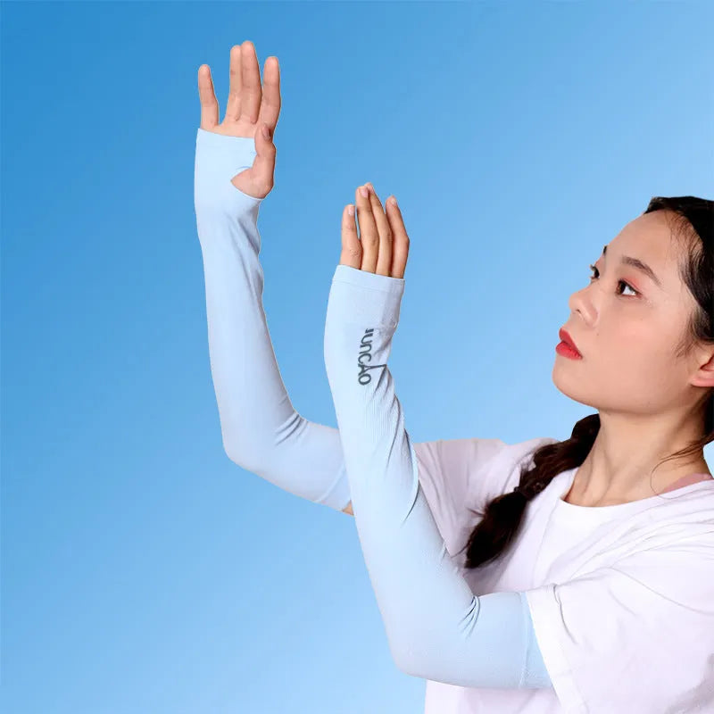 A person wearing a grey sun protection driving sleeve on their forearm, showing the open finger design.