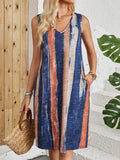 Sleeveless V-neck dress with colour block panels in a midi length and mid-waist silhouette.
