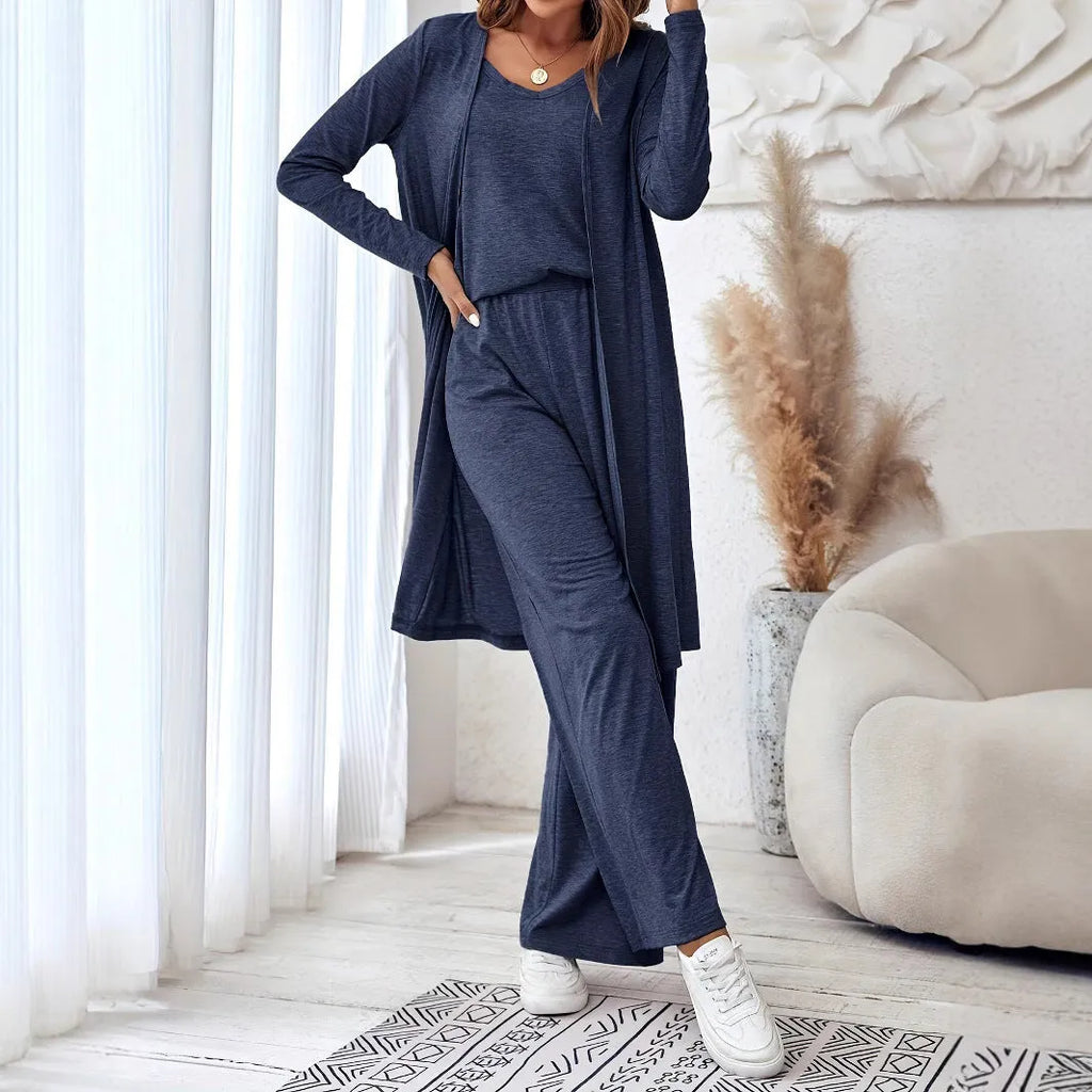 Blue women's three-piece casual suit with sling top, long cardigan, and trousers on a hanger.