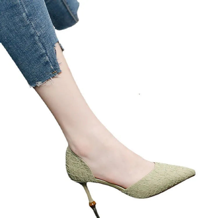 Women's black pointed toe stiletto high heels with a leather upper and thin heel.
