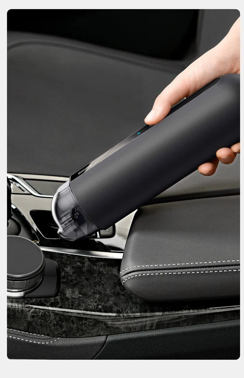 Black handheld wireless car vacuum cleaner with nozzle and blowing hose accessory