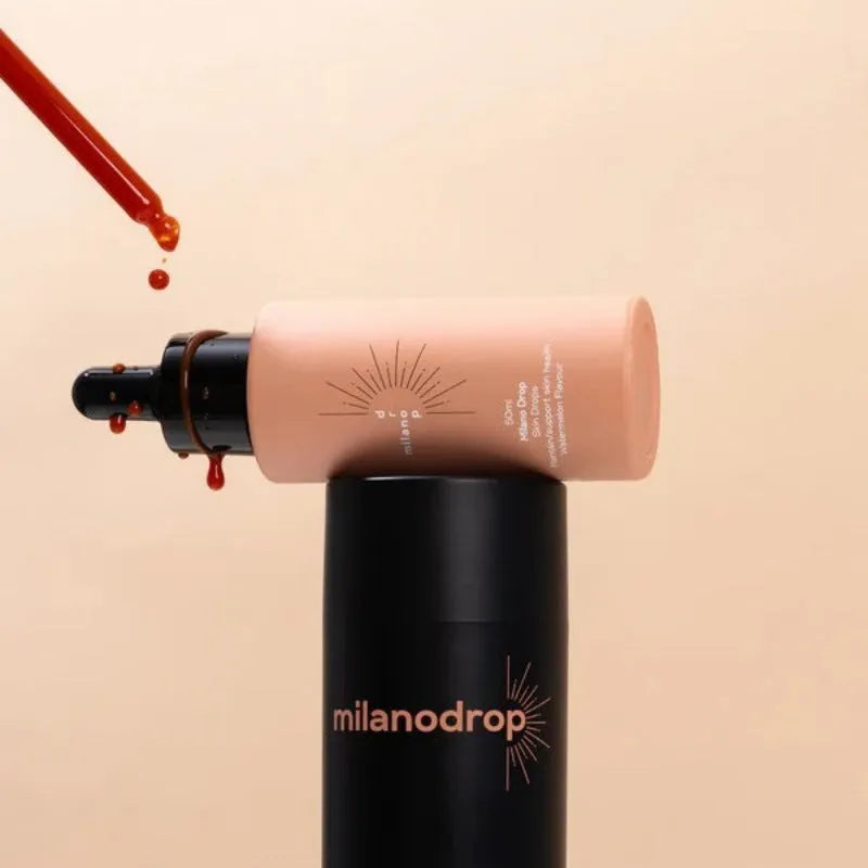 Matte sun tanning black liquid product duo showing 50ml tanning drops bottle and 75ml tanning flash cream tube