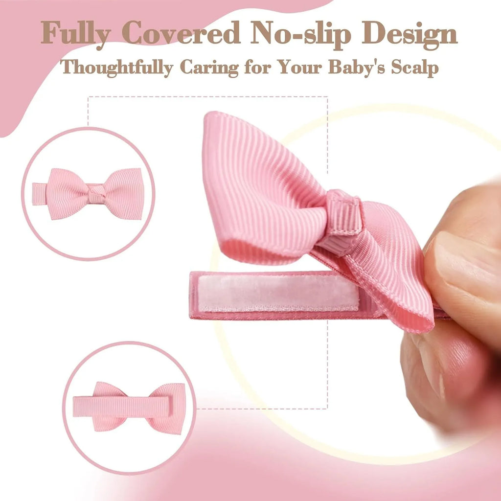 Assortment of pastel-coloured hair clips and bows for babies and toddlers on a white background.
