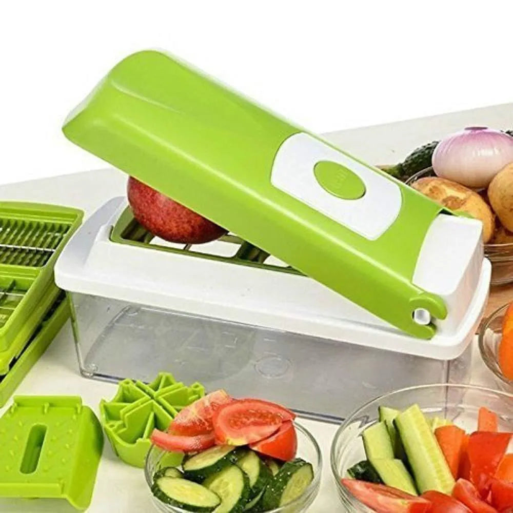 Green manual food chopper with stainless steel blades on a kitchen counter.