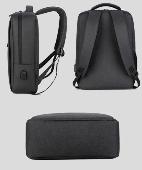 Waterproof rechargeable backpack laptop bag in black for a 15.6-inch computer.