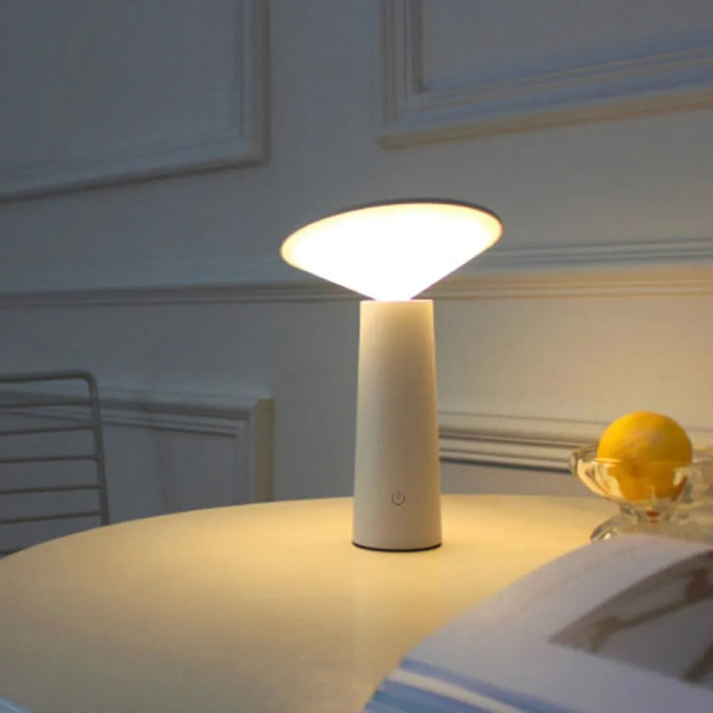 Black USB LED table lamp with touch controls and adjustable 40-degree lamp head on wooden surface