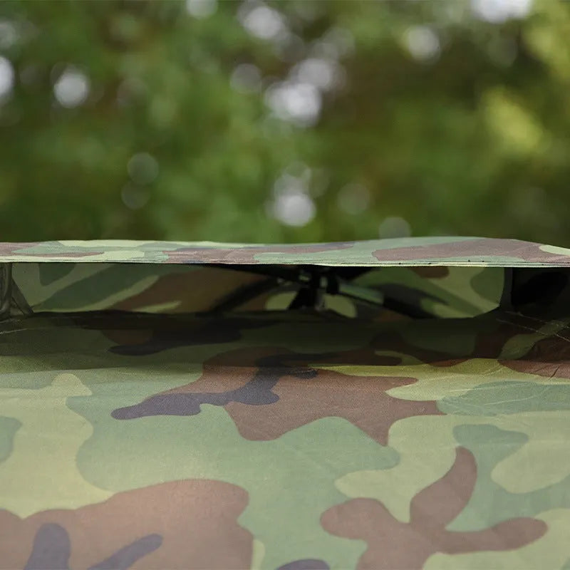 Green camouflage camping tent with mesh windows and steel ground pegs