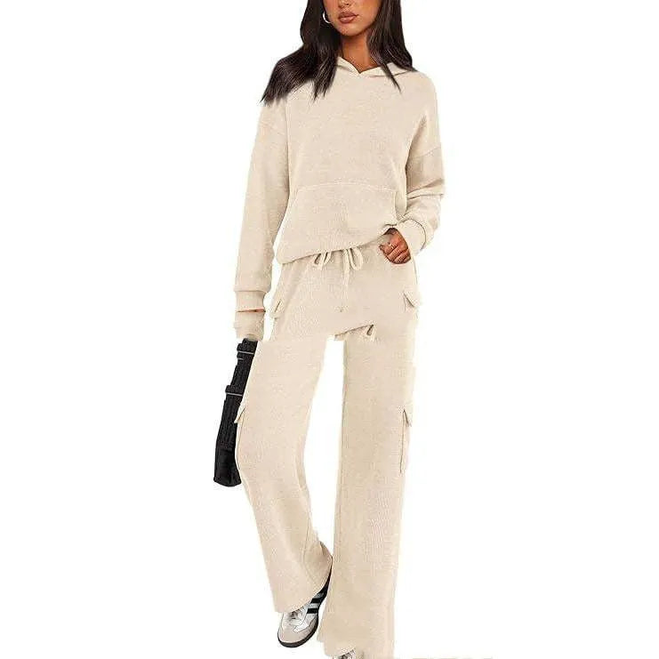 Women's long sleeve leisure sport suit top and trousers set in polyester fabric.