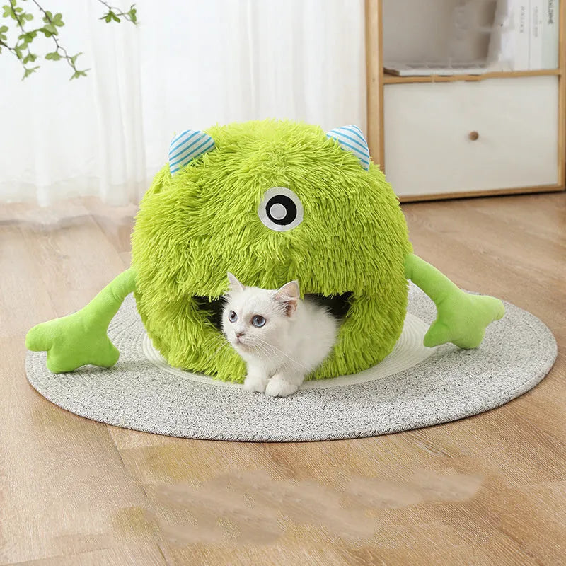A round fluffy plush pet bed for cats and small dogs on a wooden floor.