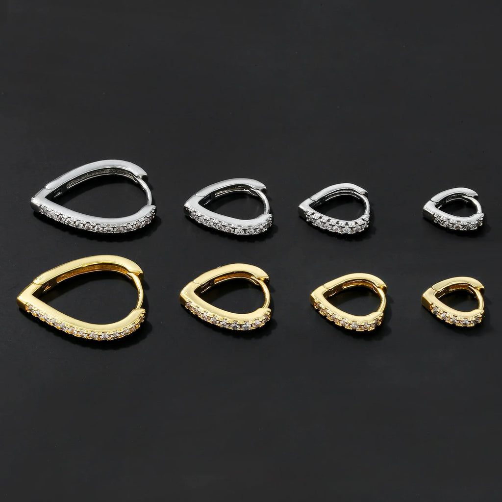 Gold geometric heart-shaped clip-on earring for women on a white background.