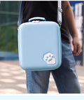 Nintendo Switch cat claw storage bag with shoulder strap, shown in black, holding game cartridges.